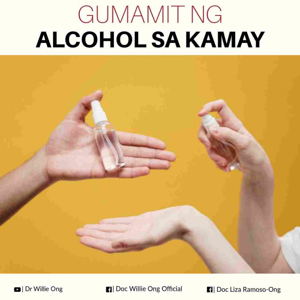 A photo of hands spraying alcohol